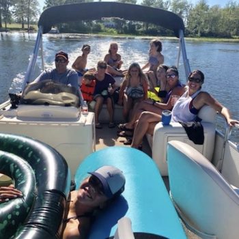 Several individuals on a boat having fun