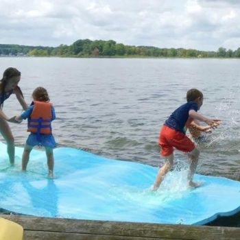 A family enjoys a fun day on an inflatable raft